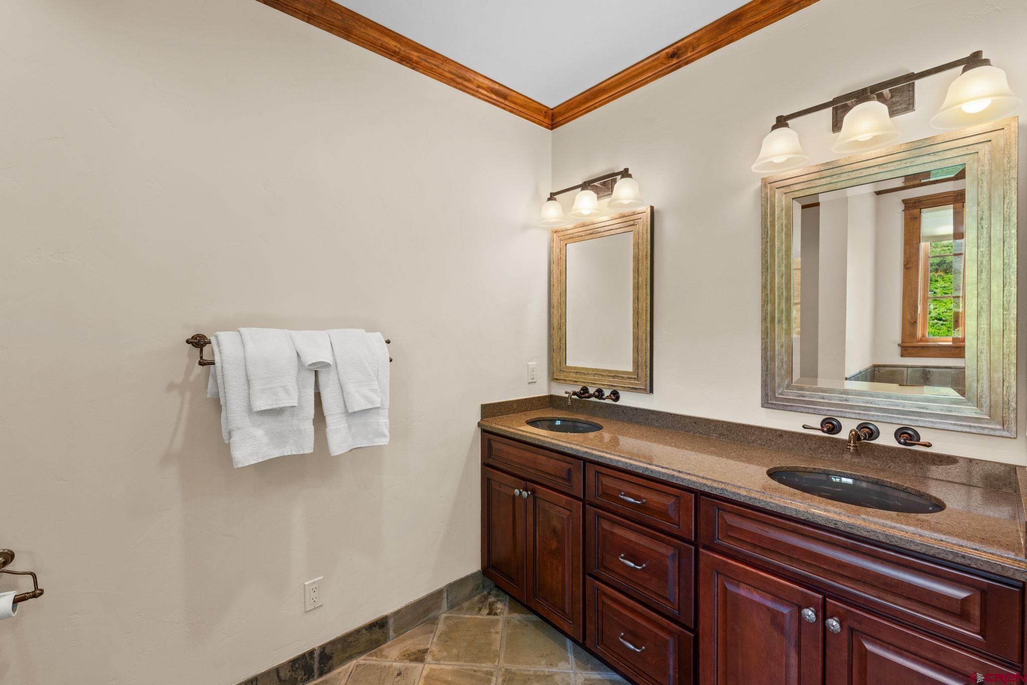 59 Summit Road Crested Butte, CO 81225 - Photo 17 of 45 a bathroom with a sink and a mirror