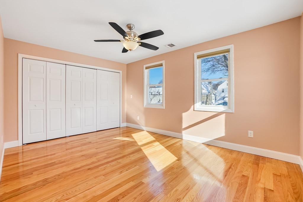 52 Savory Street, Unit 52 Lynn, MA 01904 - Photo 11 of 29 a view of a livingroom with wooden floor and a window