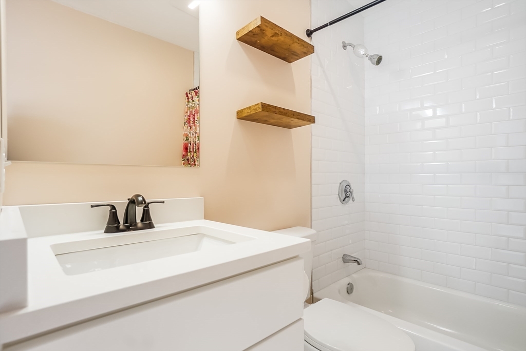 52 Savory Street, Unit 52 Lynn, MA 01904 - Photo 13 of 29 a bathroom with a sink and a mirror