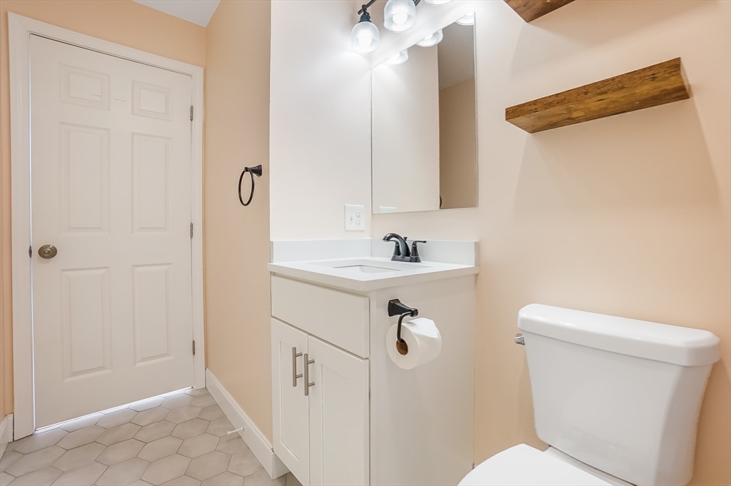 52 Savory Street, Unit 52 Lynn, MA 01904 - Photo 14 of 29 a bathroom with a sink a toilet and shower