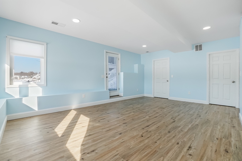 52 Savory Street, Unit 52 Lynn, MA 01904 - Photo 19 of 29 a view of livingroom with hardwood floor and hallway