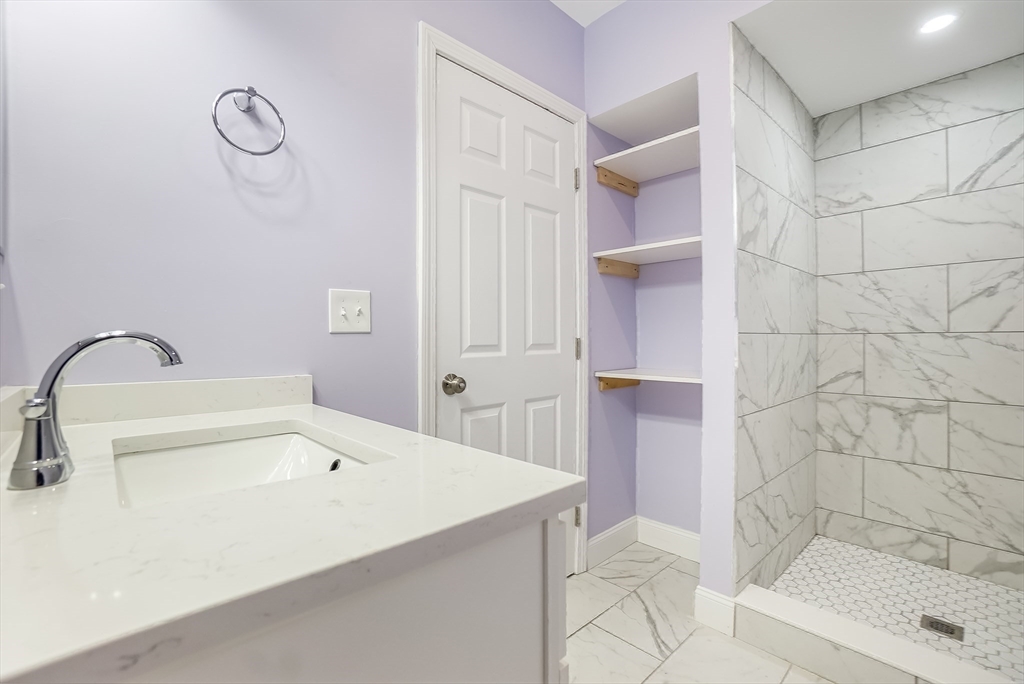 52 Savory Street, Unit 52 Lynn, MA 01904 - Photo 20 of 29 a bathroom with a bathtub and shower