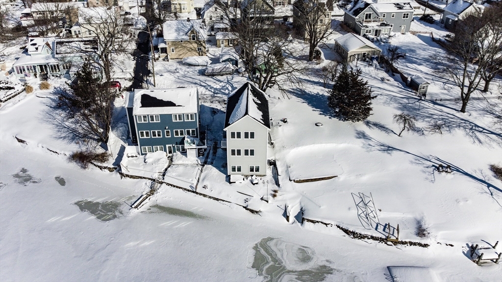 52 Savory Street, Unit 52 Lynn, MA 01904 - Photo 25 of 29 a white house with a tree in the background