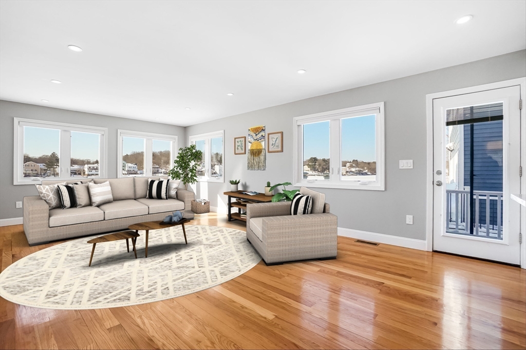 52 Savory Street, Unit 52 Lynn, MA 01904 - Photo 4 of 29 a living room with furniture and a wooden floor