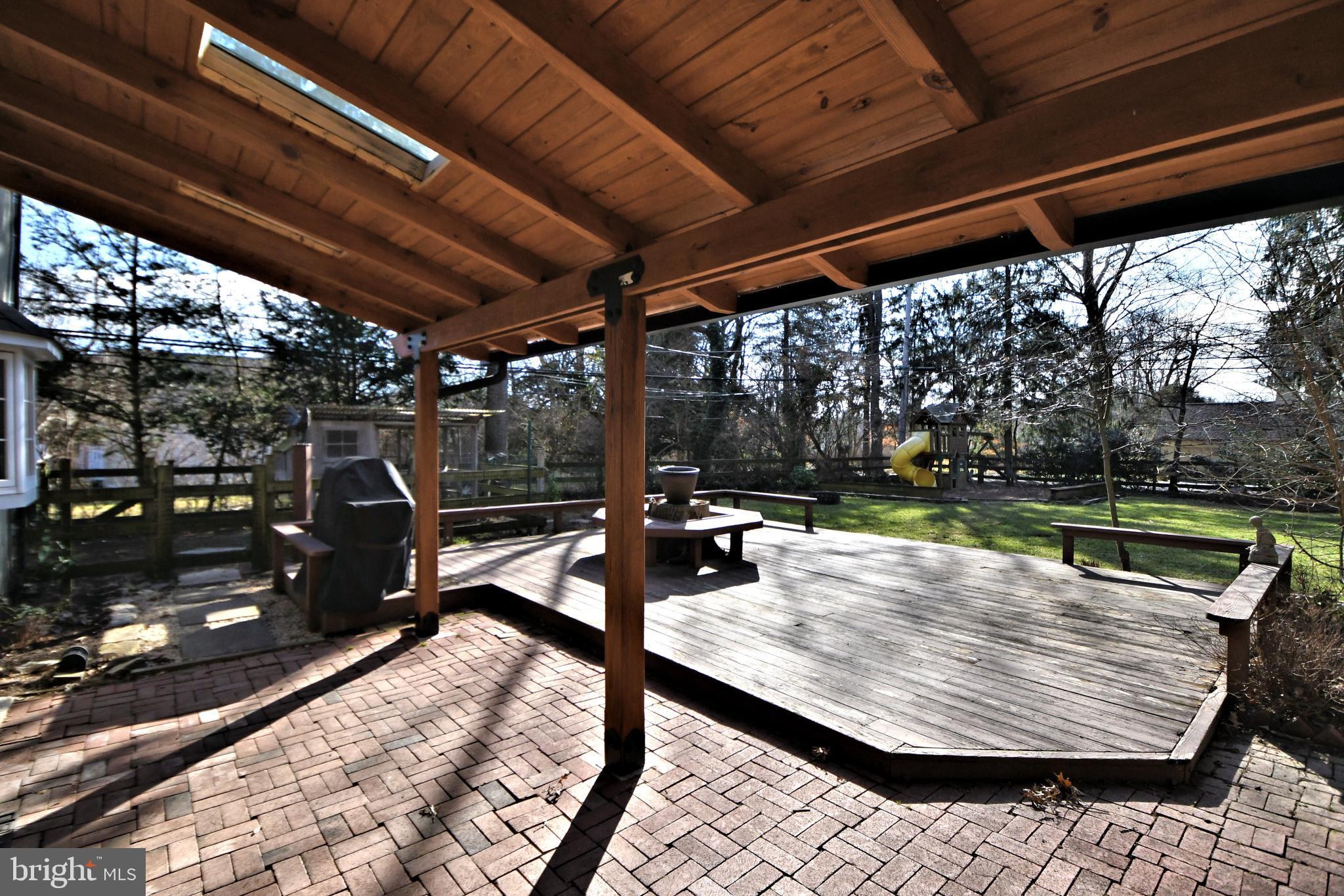 2002 Hilltop Road Flourtown, PA 19031 - Photo 58 of 64 Covered brick patio and deck