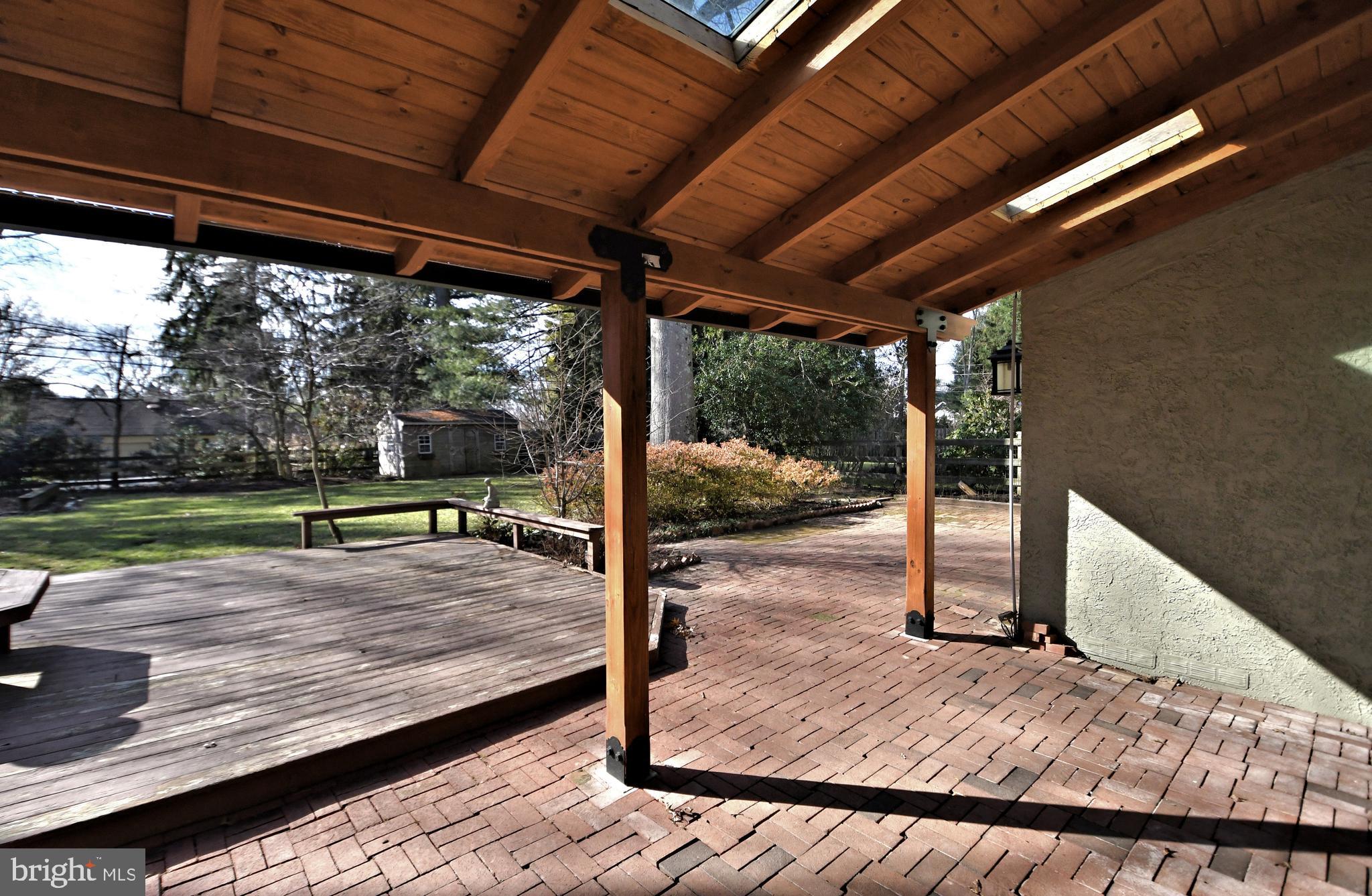 2002 Hilltop Road Flourtown, PA 19031 - Photo 59 of 64 Covered brick patio and deck