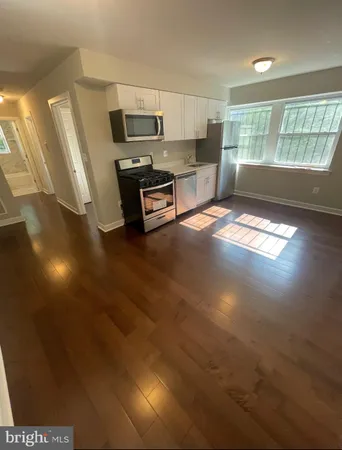 a kitchen with cabinets and a fireplace