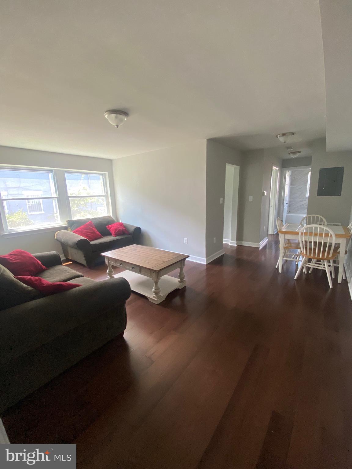 52 Forrester Street Southwest Washington, DC 20032 - Photo 12 of 18 a living room with furniture and a table