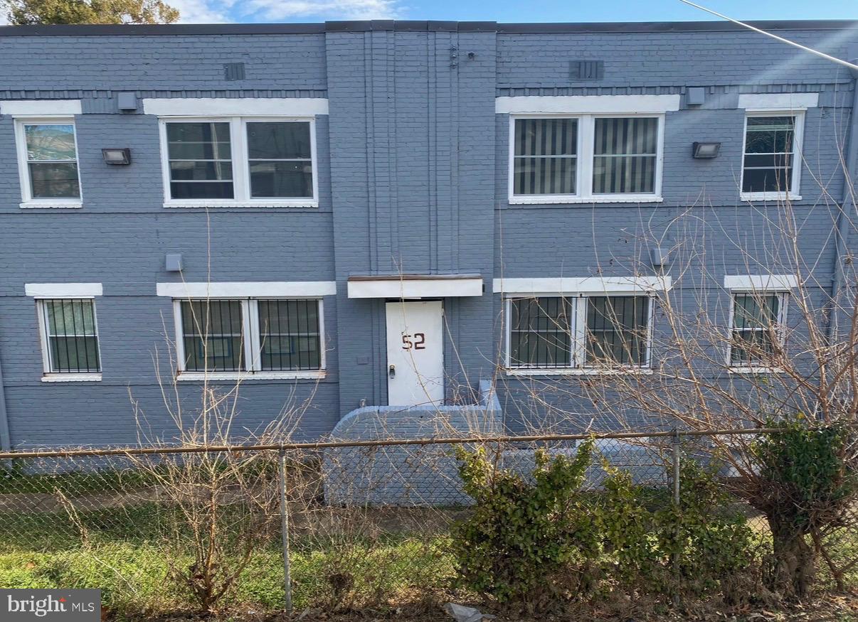 52 Forrester Street Southwest Washington, DC 20032 - Photo 18 of 18 a large brick building with a large windows
