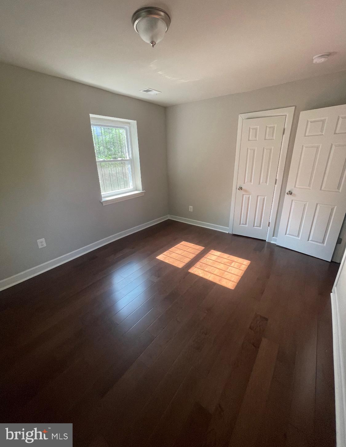 52 Forrester Street Southwest Washington, DC 20032 - Photo 3 of 18 an empty room with windows