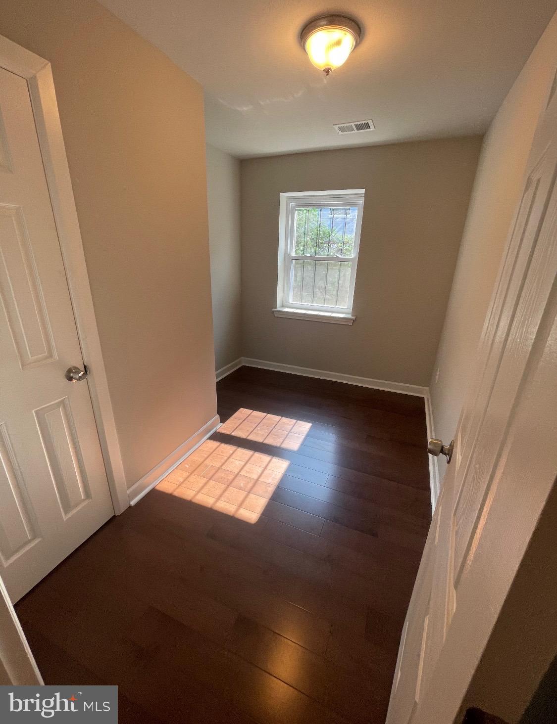 52 Forrester Street Southwest Washington, DC 20032 - Photo 5 of 18 a view of empty room with wooden floor and fan