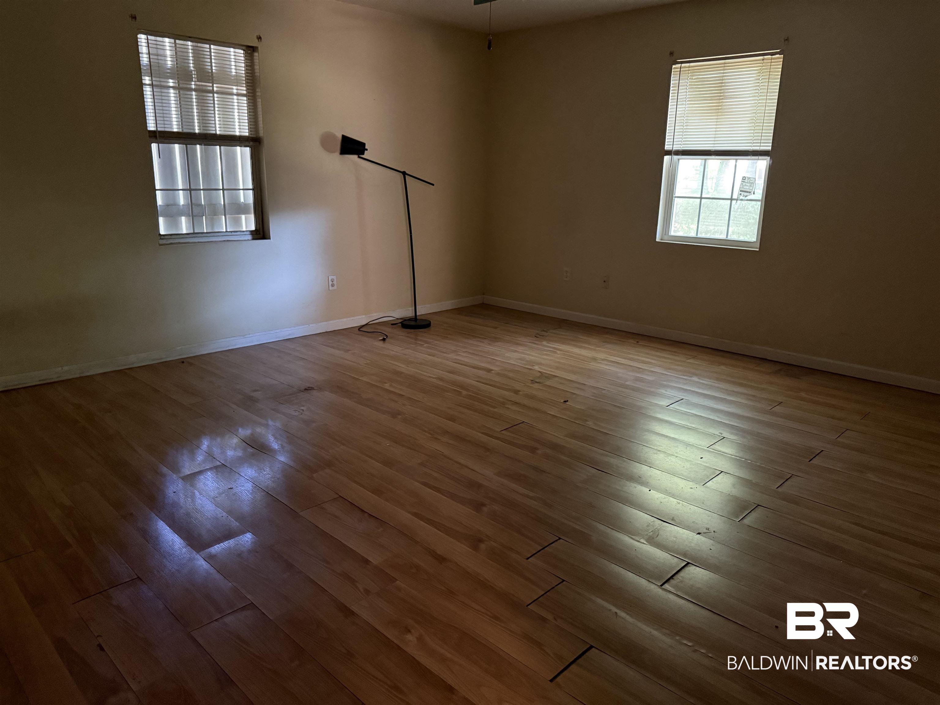 1909 Brill Road Mobile, AL 36605 - Photo 6 of 15 Unfurnished room with light wood finished floors and baseboards