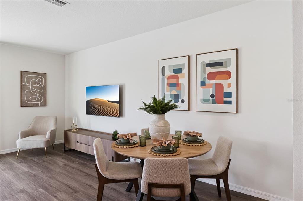 4356 Butterscotch Circle Lakeland, FL 33811 - Photo 15 of 30 a dining room with furniture and wooden floor