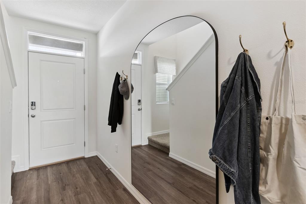 4356 Butterscotch Circle Lakeland, FL 33811 - Photo 2 of 30 a view of a hallway with wooden floor and staircase