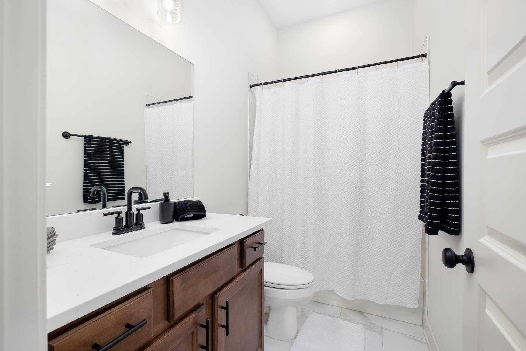 5628 Gerber Road Arlington, TN 38002 - Photo 14 of 40 Bathroom with vanity and light marble finish flooring