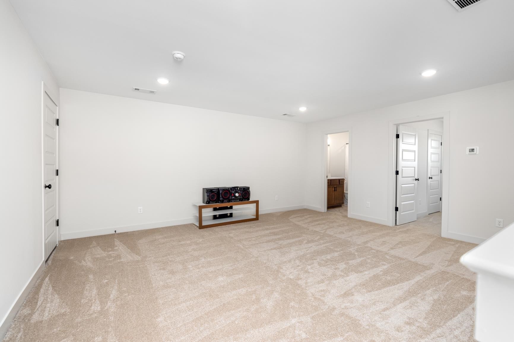 5628 Gerber Road Arlington, TN 38002 - Photo 16 of 40 Unfurnished living room with light colored carpet and recessed lighting