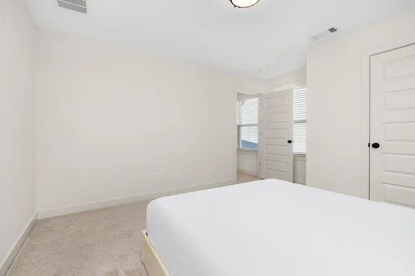 a view of a dining room with furniture and window