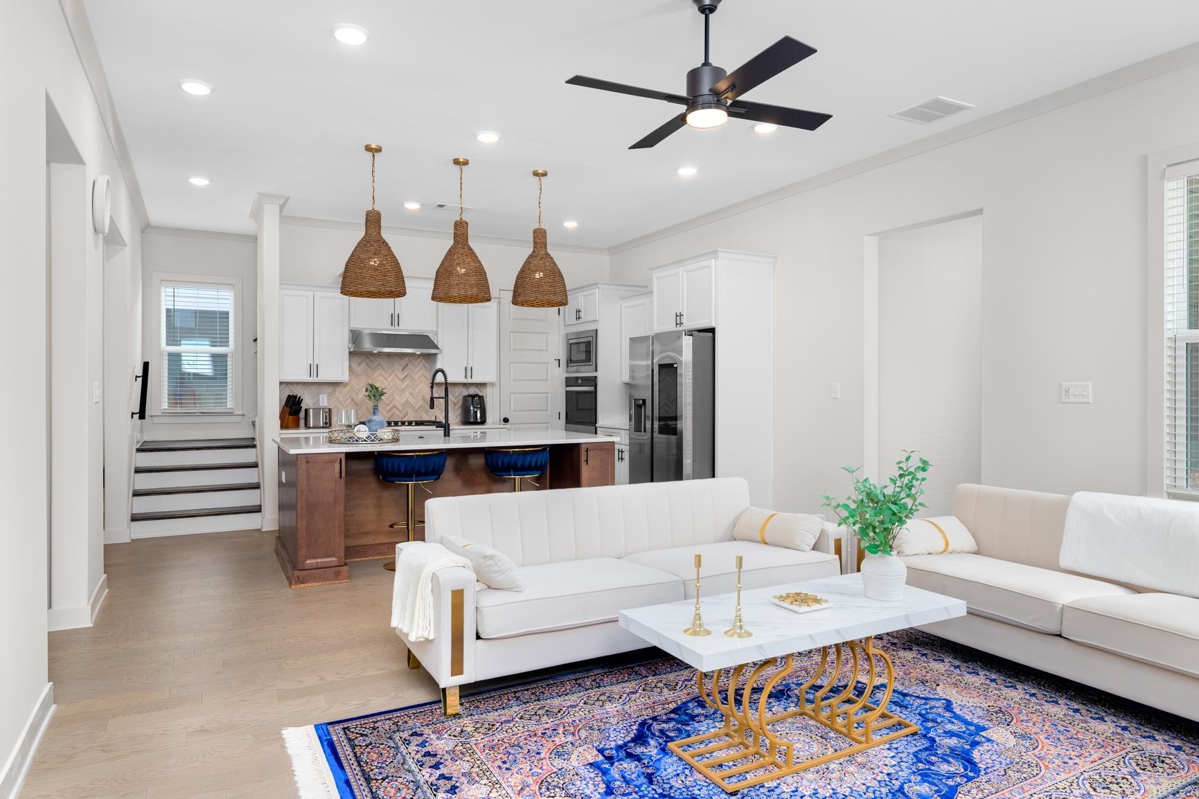 5628 Gerber Road Arlington, TN 38002 - Photo 24 of 40 Living room with stairway, light wood-type flooring, crown molding, and a ceiling fan