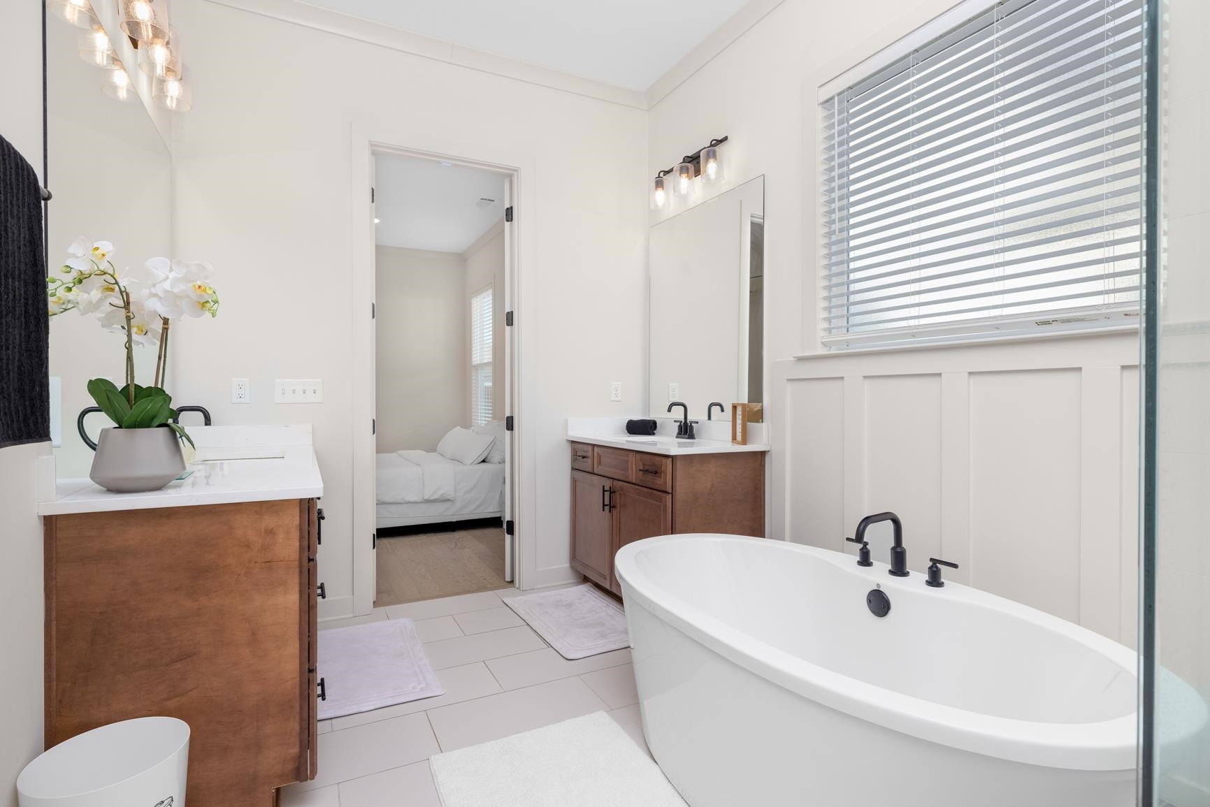 5628 Gerber Road Arlington, TN 38002 - Photo 24 of 40 Full bath with vanity, a freestanding tub, crown molding, connected bathroom, and light tile patterned flooring