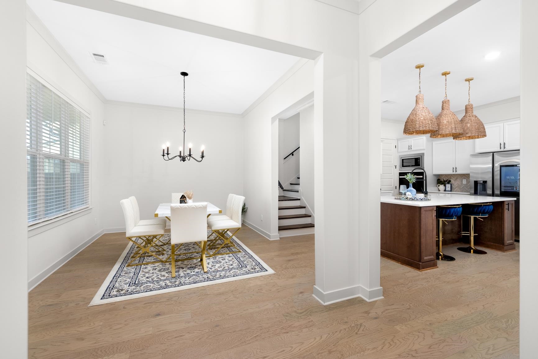 5628 Gerber Road Arlington, TN 38002 - Photo 32 of 40 Dining room with a chandelier, light wood-style floors, stairway, and ornamental molding