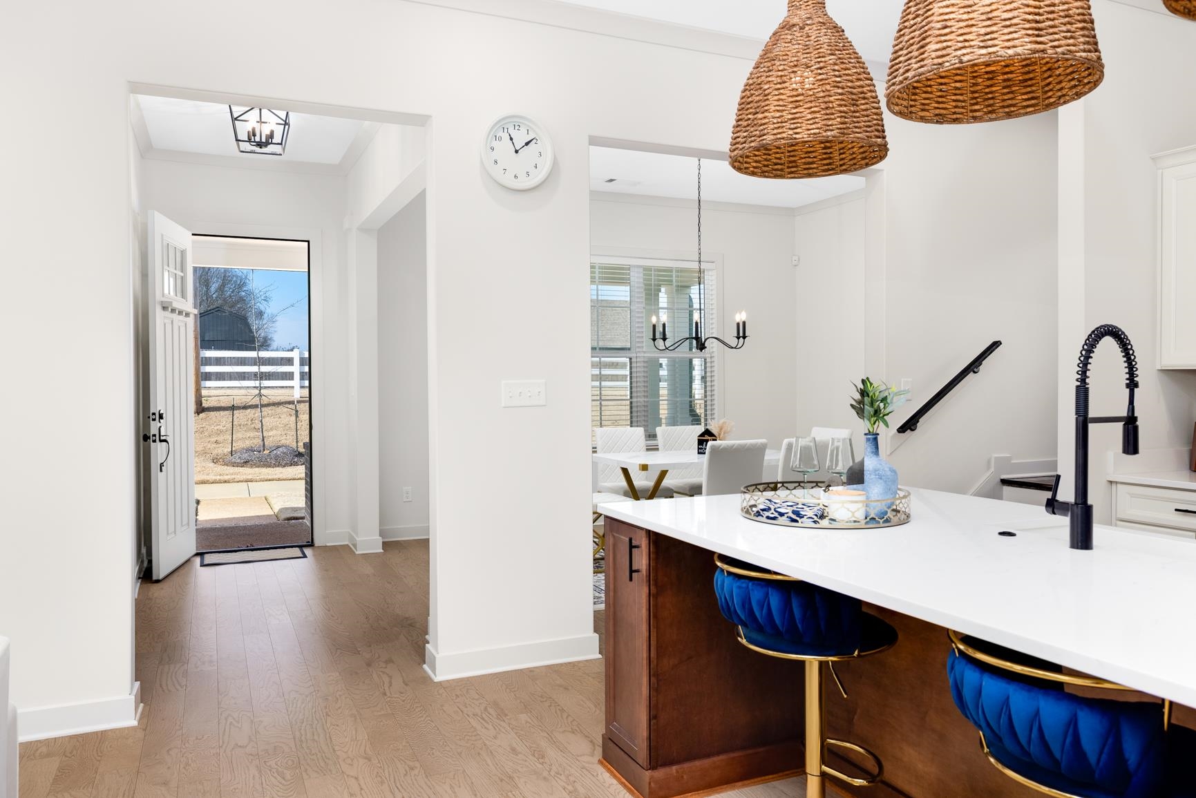 5628 Gerber Road Arlington, TN 38002 - Photo 6 of 40 Kitchen with a chandelier, light wood-style floors, a breakfast bar area, light stone countertops, and pendant lighting
