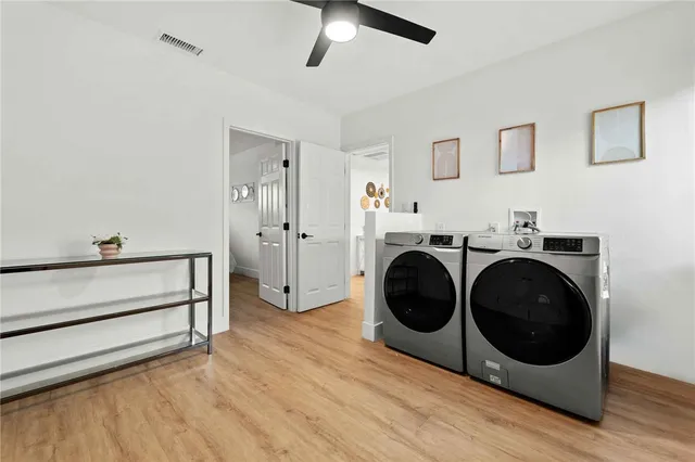 a utility room with sink dryer and washer
