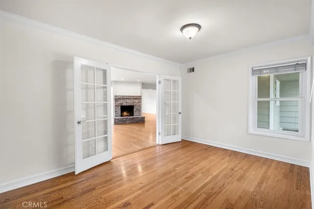 a bathroom with a sink a toilet a mirror and shower