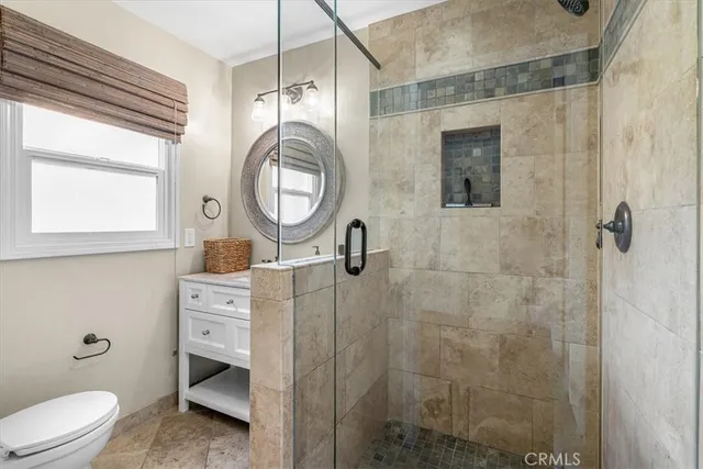 a bathroom with a shower and a toilet