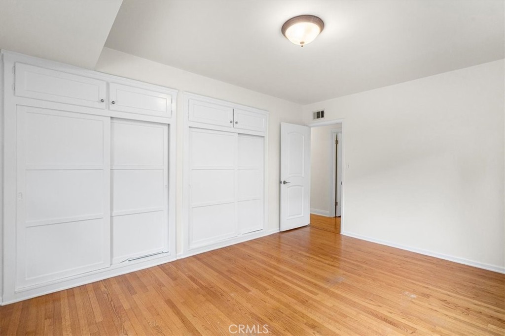 54 Ranchview Road Rolling Hills Estates, CA 90274 - Photo 30 of 60 a view of an empty room with wooden floor