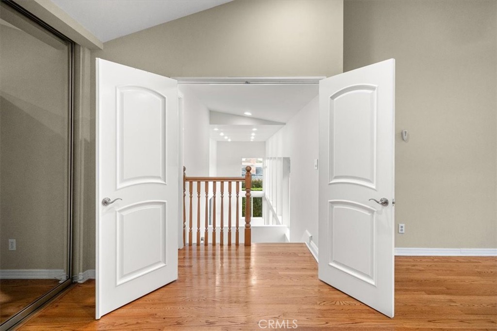 54 Ranchview Road Rolling Hills Estates, CA 90274 - Photo 33 of 60 a view of a hallway with wooden floor and staircase