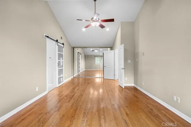 a spacious bathroom with a granite countertop sink mirror and toilet