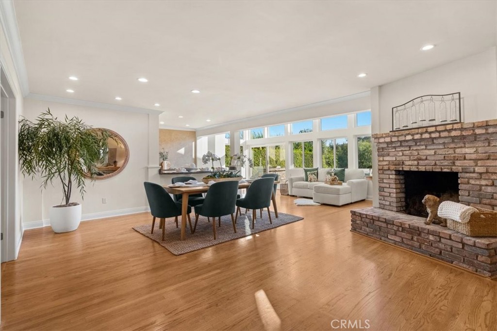 54 Ranchview Road Rolling Hills Estates, CA 90274 - Photo 4 of 60 a living room with furniture a dining table and a fireplace