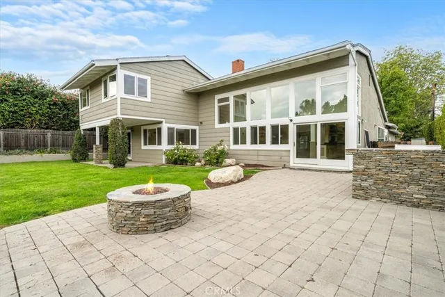 an aerial view of house with yard swimming pool and outdoor seating