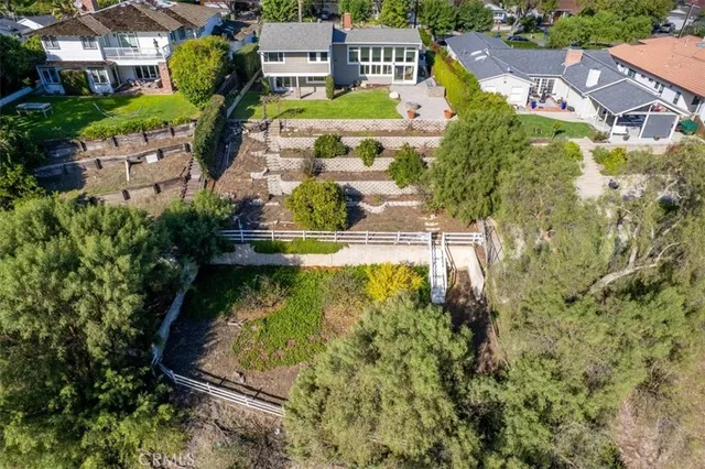 an aerial view of a house with a swimming pool