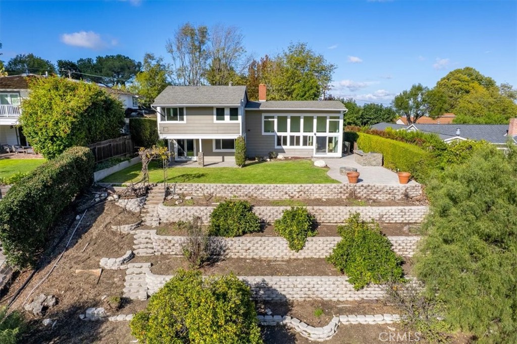 54 Ranchview Road Rolling Hills Estates, CA 90274 - Photo 54 of 60 a front view of a house with a yard