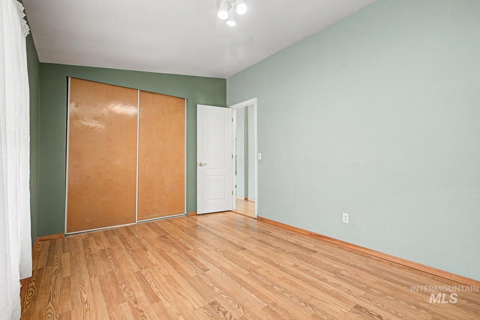1480 Birch Street Clarkston, WA 99403 - Photo 21 of 30 Unfurnished bedroom with light wood finished floors and a closet
