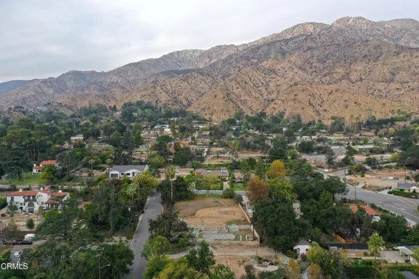 an aerial view of residential house and green space