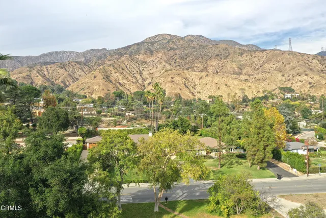 a view of a mountain range in a cloudy sky