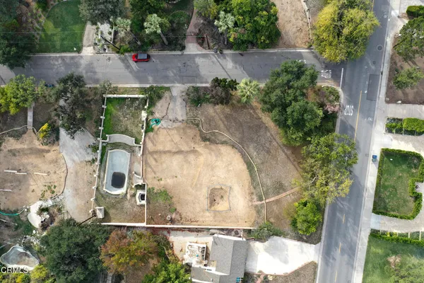 an aerial view of a house with outdoor space