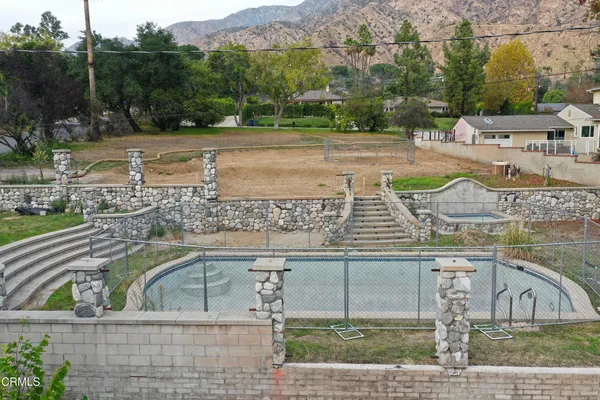 a view of a swimming pool with a patio
