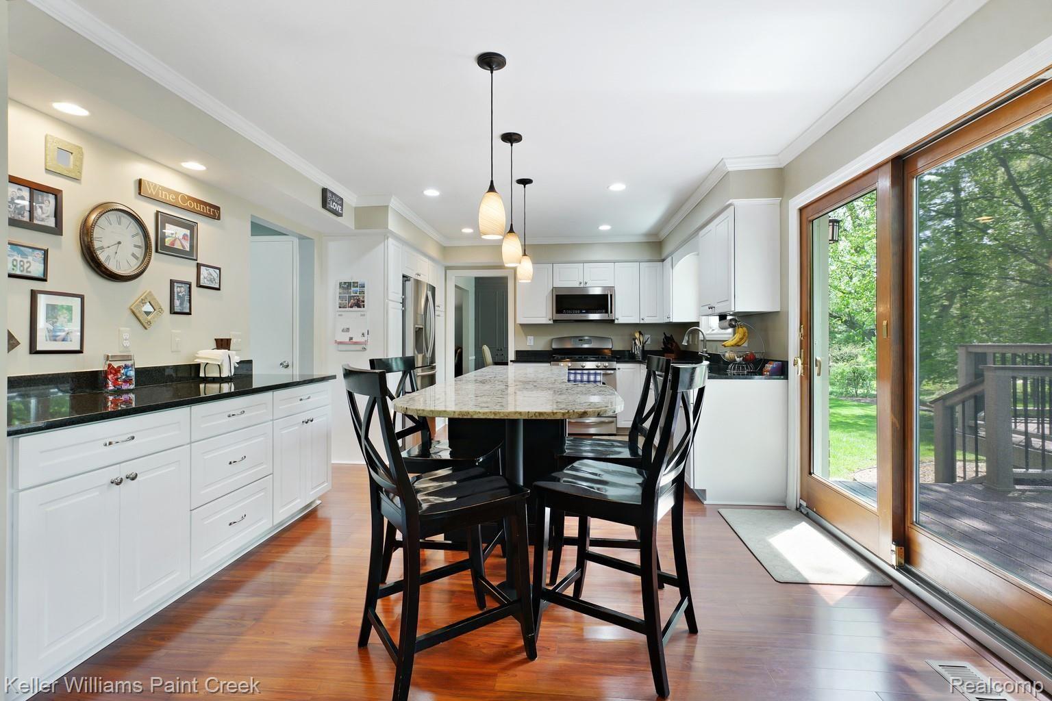 1491 Biggers Drive Rochester, MI 48309 - Photo 21 of 42 Huge eat-in Island has room for everyone!