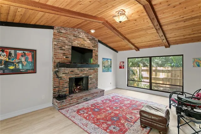 a bedroom with bed and a chandelier