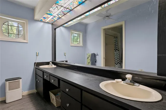 a bedroom with a bed and a chair