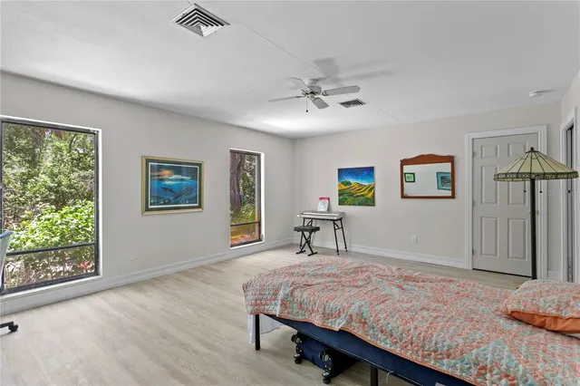 a bed room with a bed and a book shelf