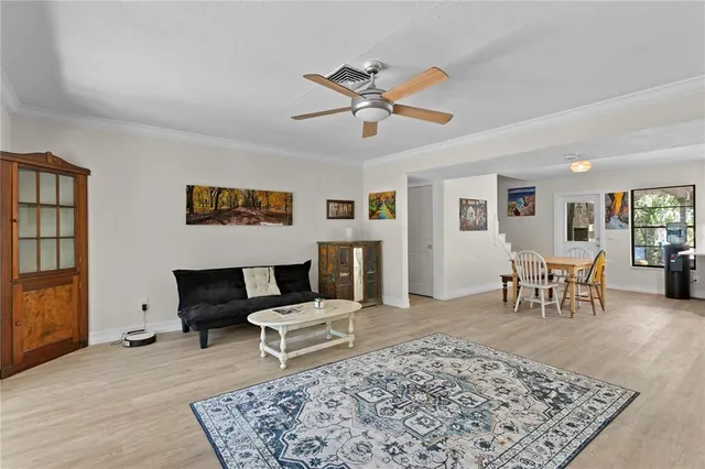 a living room with furniture and a rug