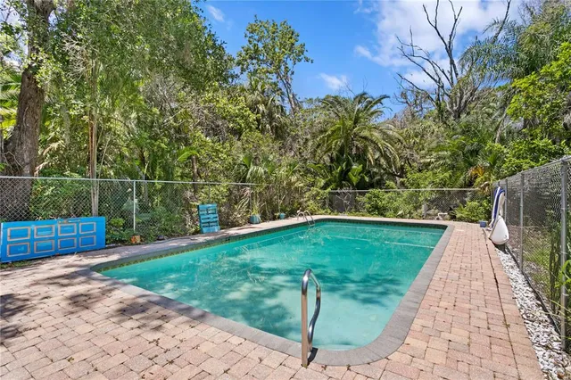 a view of a dining room with furniture and a window