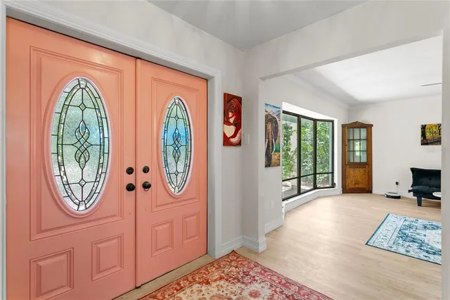 a kitchen with a sink stainless steel appliances and white cabinets