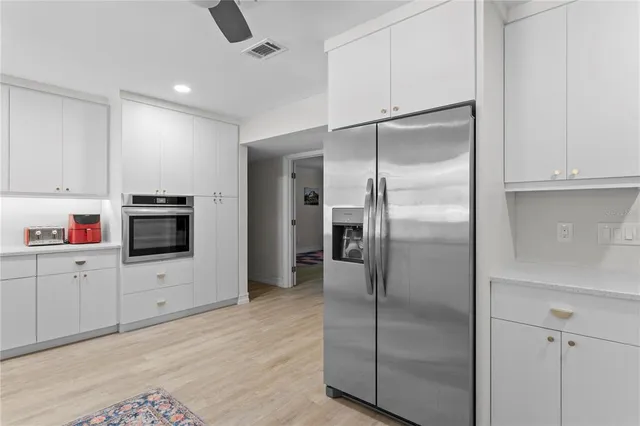 a kitchen with a large window and a sink