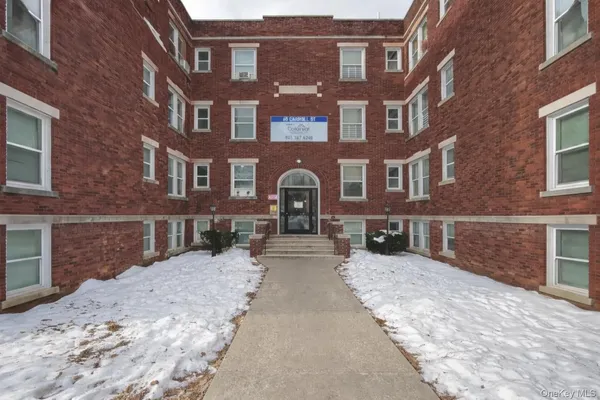 a view of a building with a yard