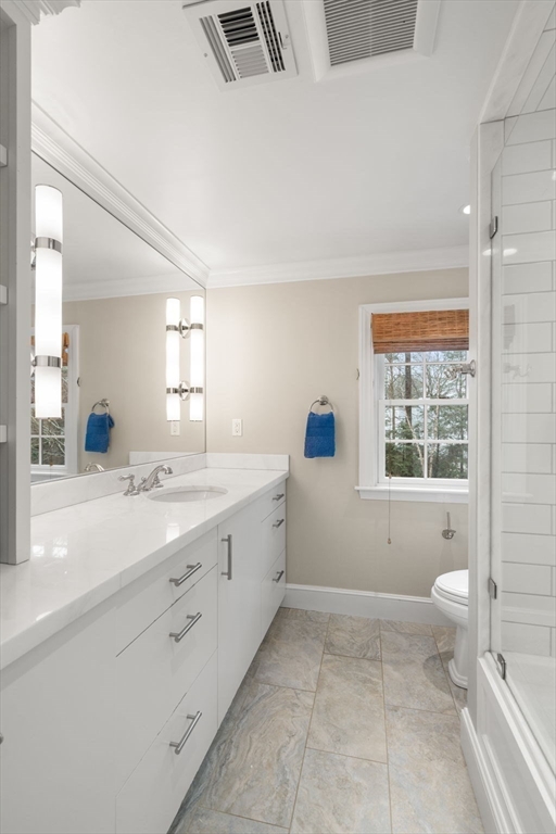 48 Scotch Pine Road Wellesley, MA 02481 - Photo 28 of 39 a bathroom with a granite countertop sink a toilet and a bathtub